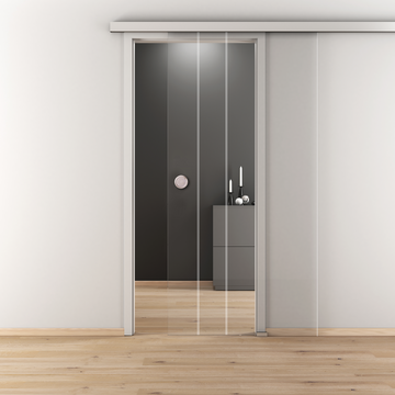 Ambientebild in Wohnraumsituation illustriert die Diamond Doors Glasschiebetür DD 595 in der Ausführung ESG BASIC GREEN klar