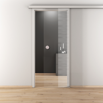 Ambientebild in Wohnraumsituation illustriert die Novadoors Glasschiebetür NOVA 557 in der Ausführung ESG BASIC GREEN klar